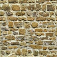 Old wall stone texture and background with rustic tiles design photo