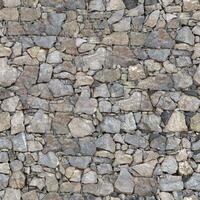 Old wall stone texture and background with rustic tiles design photo