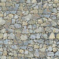 Old wall stone texture and background with rustic tiles design photo