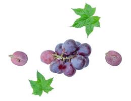 Top view set of small bunch of fresh red grapes with half and green leaves isolated on white background with clipping path photo