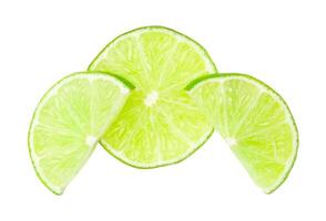 Top view of fresh green lemon slices in stack isolated on white background with clipping path photo