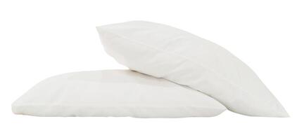 White pillows in stack after guest's use in hotel or resort room isolated on white background with clipping path. Concept of confortable and happy sleep in daily life photo