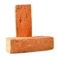 Front view of red or orange bricks in stack isolated on white background with clipping path photo