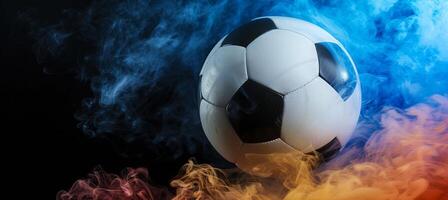 AI generated Soccer ball with colorful smoke on black background   copy space for text placement photo