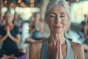 AI generated Elderly woman practicing yoga in the studio with her friends. photo