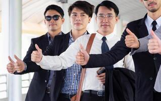 Group of Business people team showing thumbs up as a sign of success business photo