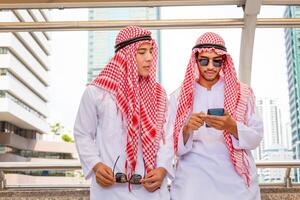 Arab businessman walking outside office, business man is walking through the city street photo