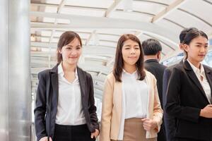 Business people meeting and sharing ideas, Young Asian business team discussing in the morning photo