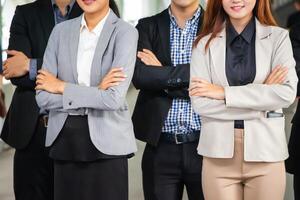 Close-up of Young business people team standing with arms crossed, Success Teamwork Concepts photo