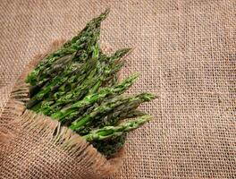 Bunches Fresh green asparagus on burlap. top view - image. High quality photo
