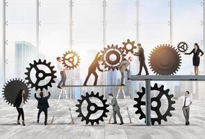 Teamwork of businesspeople work together to a system of gears as integration concept photo