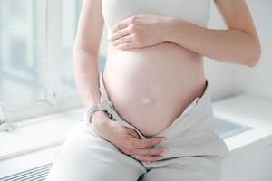 Pregnant woman close view. Pregnancy background photo