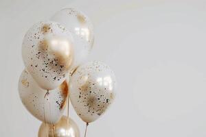 AI generated 3 foil balloons gold and white on a white background photo