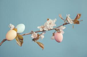 AI generated a branch of flower with some colored eggs and a few flowers on it photo