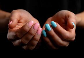 AI generated hands with pink and blue manicured nails photo