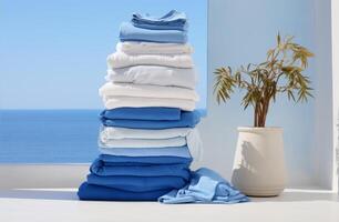 AI generated a stack of laundry stacked on a white table photo