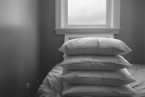 AI generated stacked white pillows on an open bed near a white frame photo