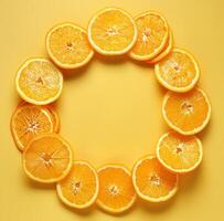 AI generated orange slices are arranged in the shape of a circle on a yellow background photo