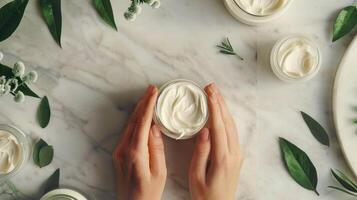 AI generated On a white marble table, female hands with cosmetic cream, jars containing cream swirls in milk photo