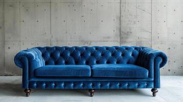 AI generated A luxurious blue velvet sofa in a modern living space against a backdrop of an empty concrete wall photo