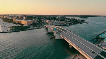 Johns Pass Madeira Beach AERIAL. Strait and waterfront that is south Florida in St. Petersburg. Strait and drawbridge at sunset. video