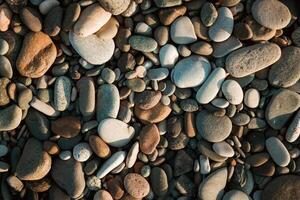 Stone pebbles on the beach as a backround photo