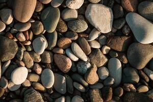 Stone pebbles on the beach as a backround photo