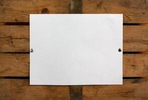 Blank paper on wooden wall photo