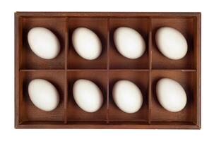 Eggs in wooden box photo
