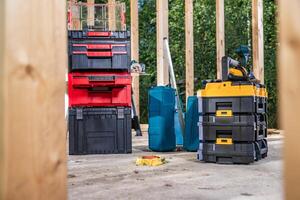 Construction Site Power Tools Inside Plastic Containers photo