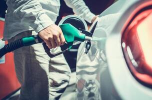 Car Owner Refueling His Vehicle on a Gas Station photo