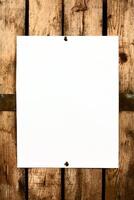 Blank paper on wooden wall photo