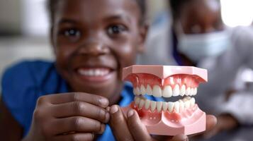 AI generated Close-up of a young child holding a dental model showing healthy teeth versus tooth decay, with the dentist explaining treatment options in the background photo