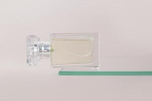 A crystal bottle of women's perfume lies on a flogging glass shelf. An empty presentation bottle. Advertising mockup of a bottle. Pastel background photo