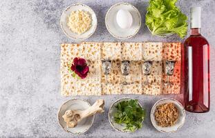 Beautiful festive background with traditional Jewish Passover treats on grey marble background. Top view. Flat layout. A copy space. photo