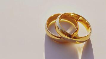 AI generated A Close-up View of Two Wedding Rings on a White Background, Bathed in Soft Illumination photo