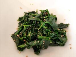 Japanese cuisine, boiled spinach with white sesame photo