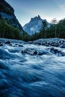 French Alps landscape of Cirque du Fer a Cheval with river flowing in the valley at Sixt Fer a Cheval, France photo