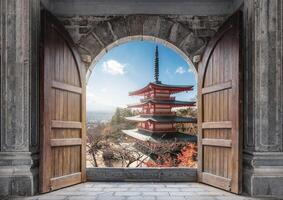 Open large wooden door with Chureito Pagoda and Mount Fuji in Autumn photo