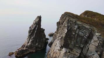 Aerial view of the beautiful rocky Cape Silina in Valentin Bay with sheer cliffs video