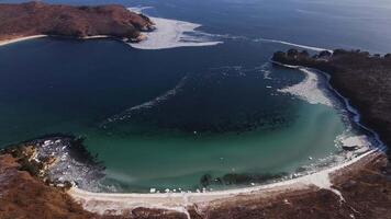 A beautiful bay with clear water in winter. sunny day video