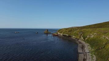 Aerial view of abandoned rusty ship on the shore of the Sea of Okhotsk video