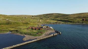 Aerial. Abandoned old building on the shore of the Sea of Okhotsk video