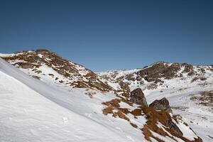 Snowy hill and blue sky on winter at Lofoten Islands, Norway photo