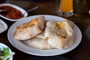 Chapati flatbread with sesame of indian food on the table photo