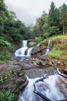 Silver waterfall or Thac Bac on fog in rainy season photo