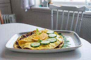 Food recipe of Omelet fried with pork chops on table photo