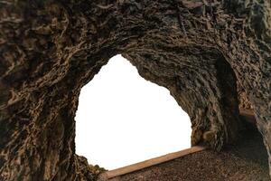 Natural linestone cave and white background photo