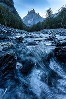 French Alps landscape of Cirque du Fer a Cheval with river flowing in the valley at Sixt Fer a Cheval, France photo