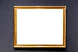 Blank antique golden carved picture frame on wall photo